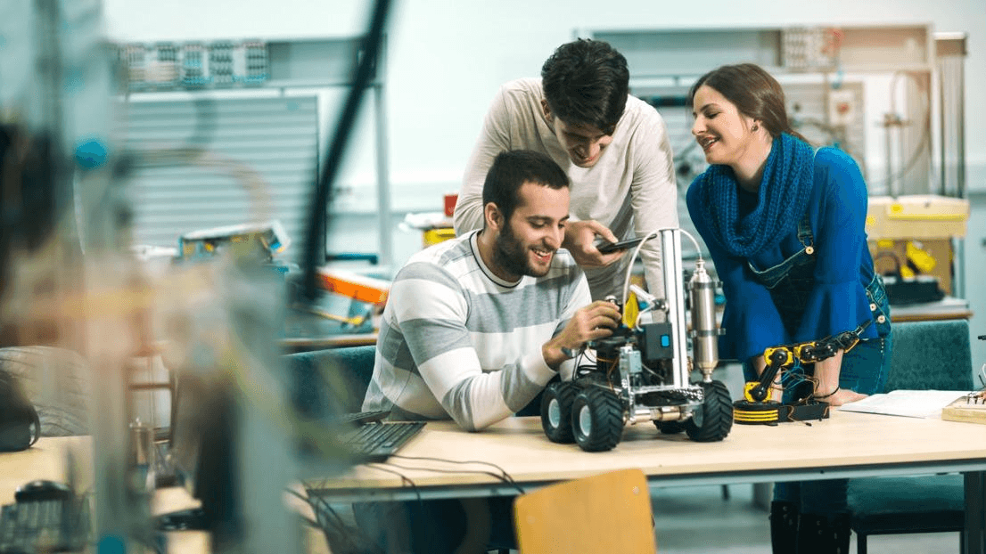 Students collaborating in a college innovation lab