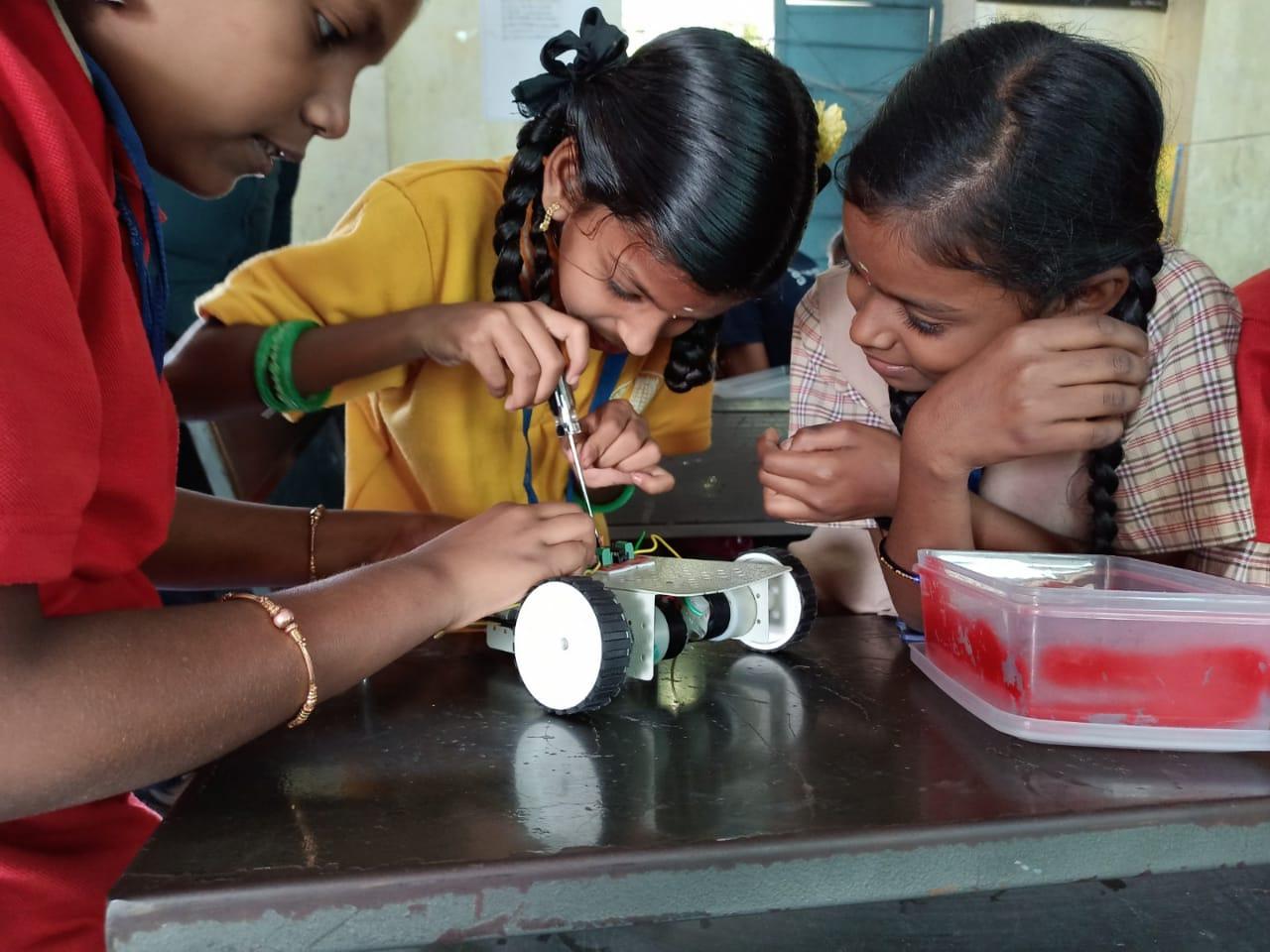 Students participating in a school robotics program